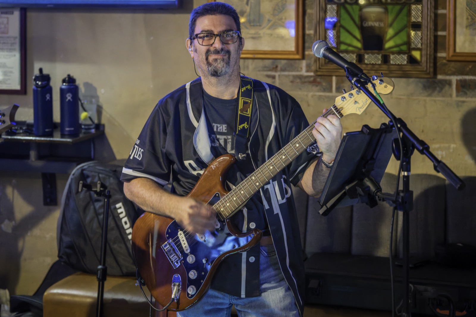 Hall Pass guitarist playing a Fender live